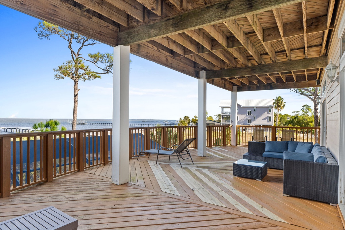 Your spacious waterfront deck offers stunning sea views with comfortable seating perfect for morning coffee or sunset cocktails.