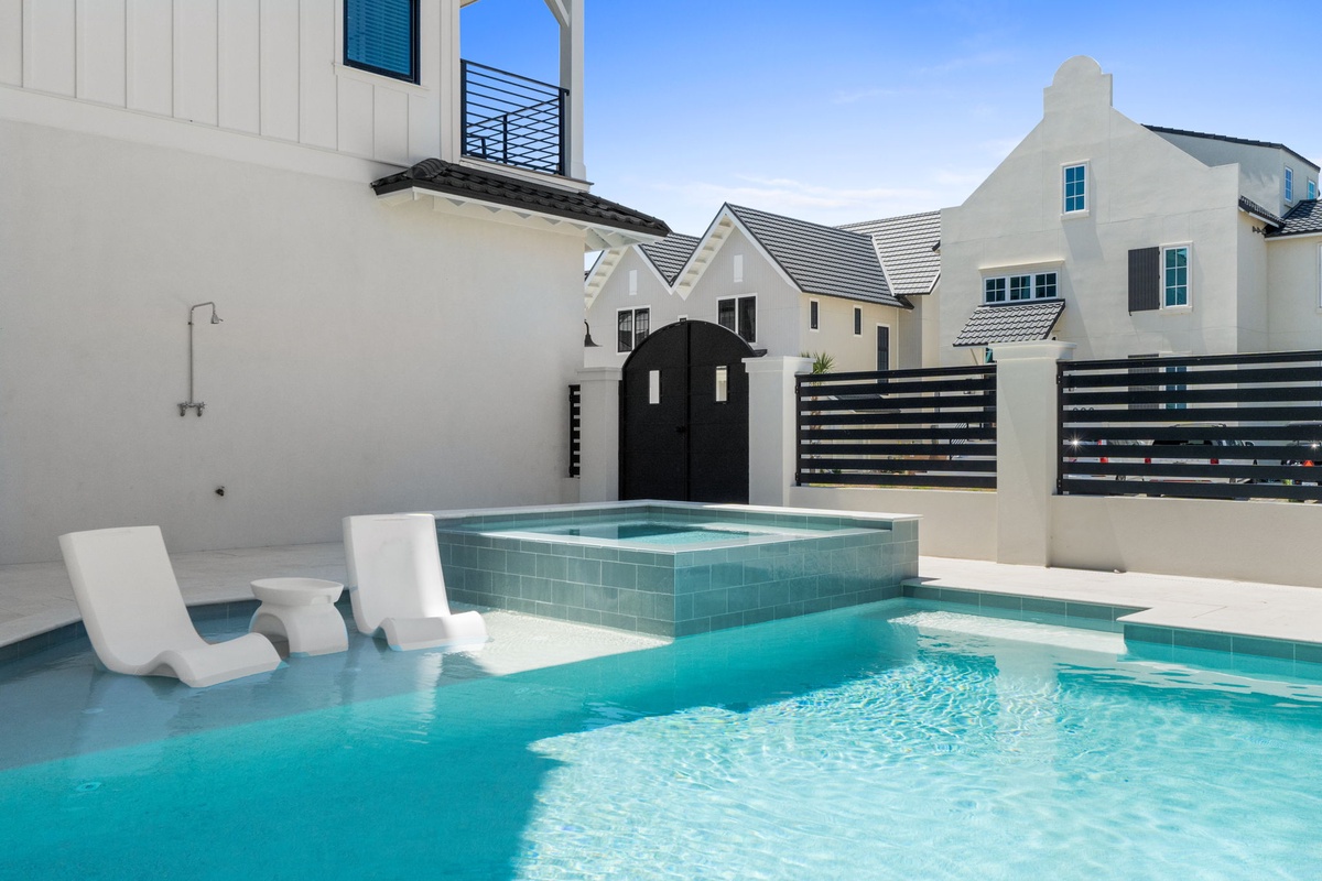 Unwind in your private pool oasis, where sleek modern design meets ultimate relaxation. The sun-drenched deck and ledge loungers offer the perfect escape.