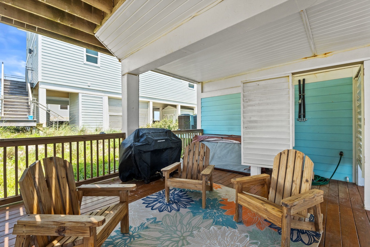 Your covered deck with Adirondack chairs and BBQ grill invites you to gather for grilled meals, morning coffee, or relaxed evenings under the coastal breeze.
