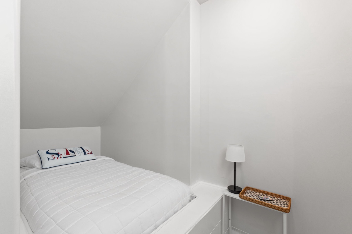 Your cozy bedroom features crisp white linens and nautical touches, creating a peaceful retreat for restful nights.