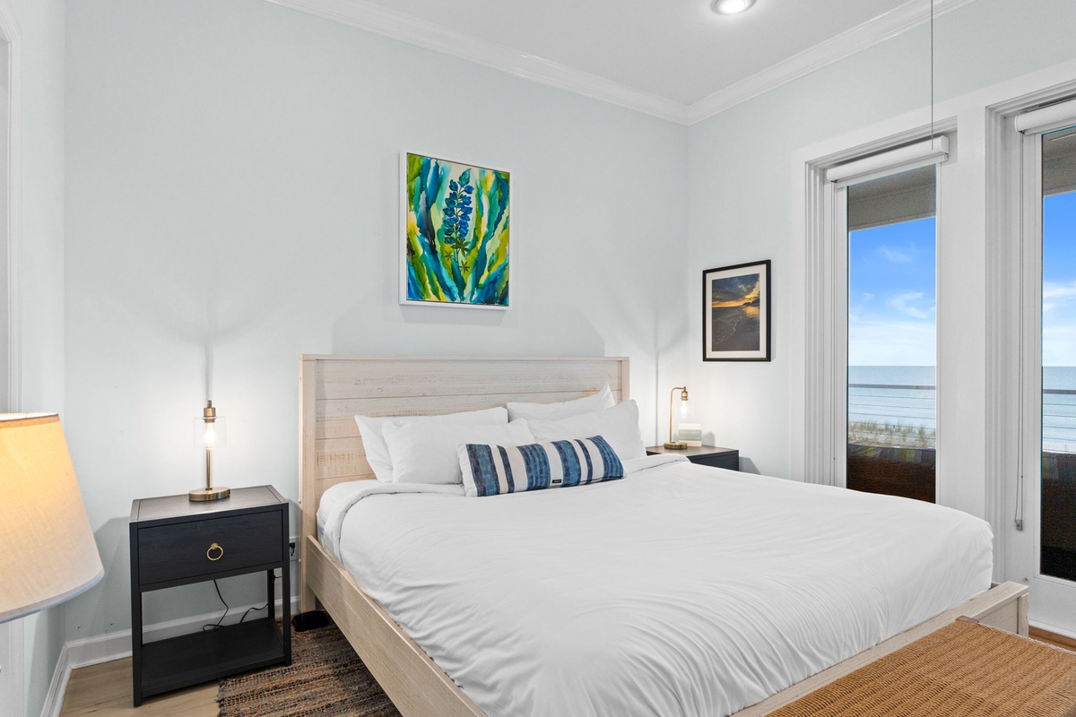 Wake up to stunning ocean views in your coastal bedroom, where crisp linens and warm lighting create the perfect seaside retreat.