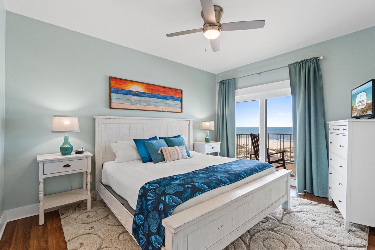 Wake up to stunning ocean views right from your bed. Soft coastal colors, crisp white linens, and that private balcony create your perfect beachside retreat.