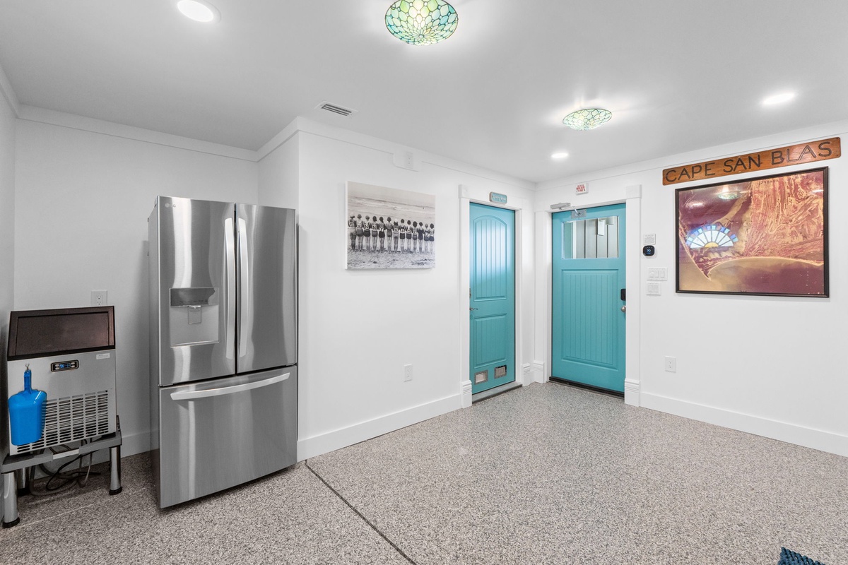 Your bright, modern space features stainless steel appliances and turquoise accents that create a fresh, coastal vibe.