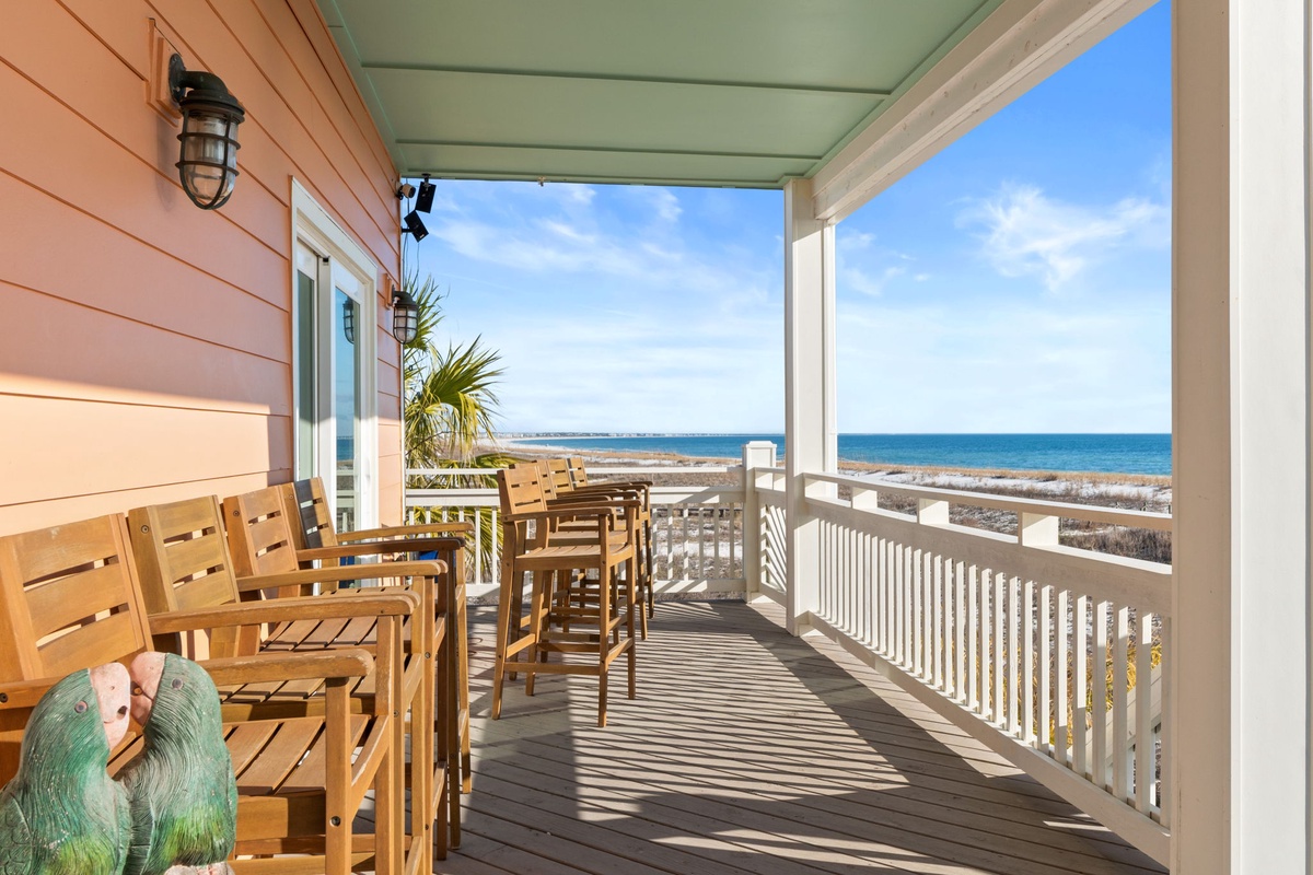 Your private oceanfront balcony awaits with comfortable seating and breathtaking sea views—perfect for morning coffee or sunset cocktails.