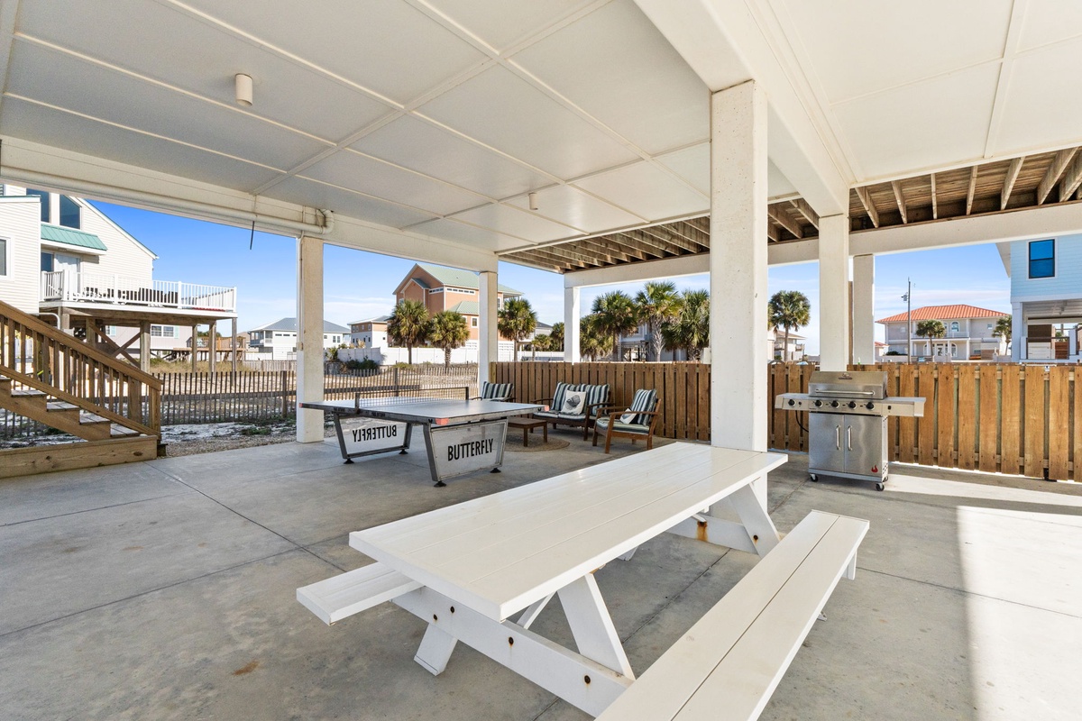 Fire up the grill and gather around your private picnic table on this spacious covered patio, perfect for outdoor dining with ocean breezes.