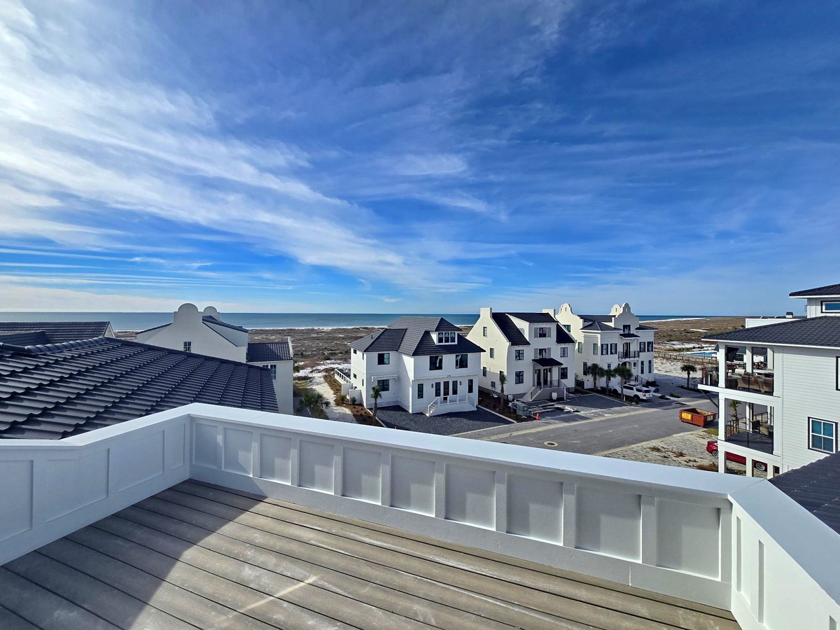 Elevated beachfront location with coastal community views stretching to the ocean beyond.