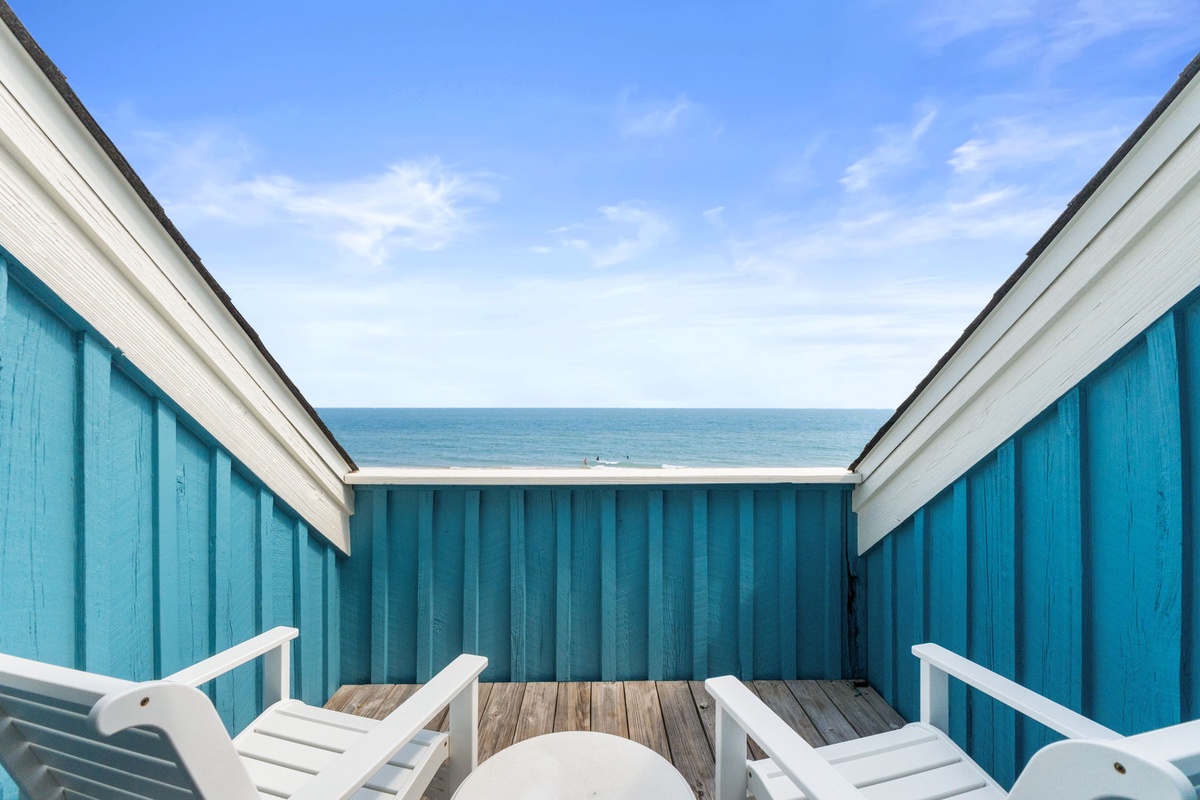 Sink into a lounge chair on your private deck and watch the waves roll in—you're just steps from the beach with endless ocean views.