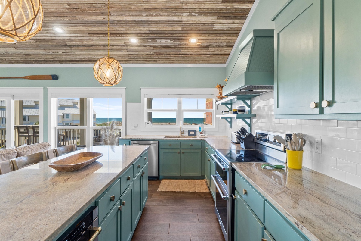 Your coastal kitchen features stunning sea views and modern appliances, perfect for preparing meals while enjoying ocean breezes.