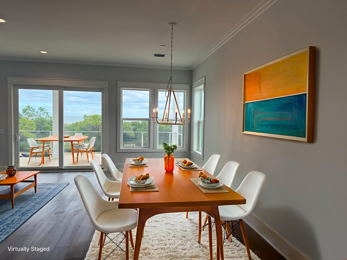 Gather around your modern dining table with lake views streaming through floor-to-ceiling windows onto the private balcony beyond.