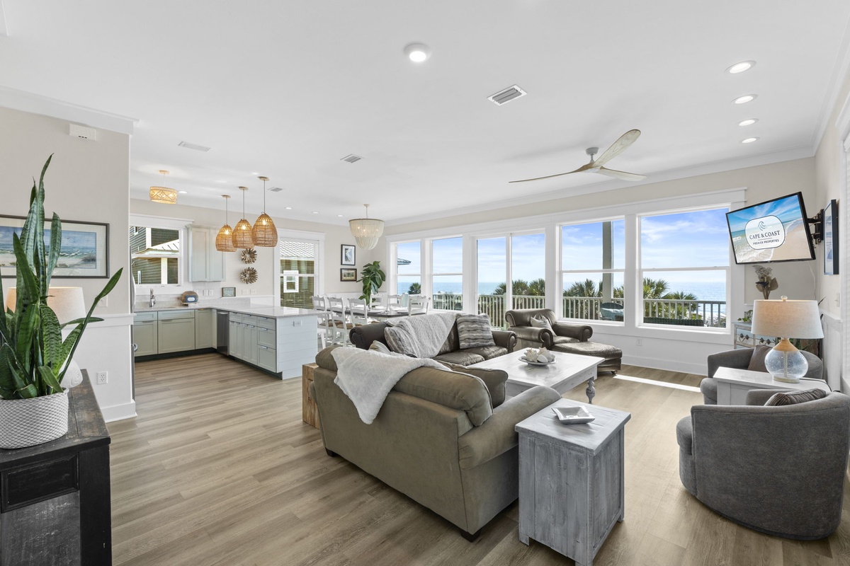 Relax in your stunning oceanfront living space with panoramic sea views through floor-to-ceiling windows.