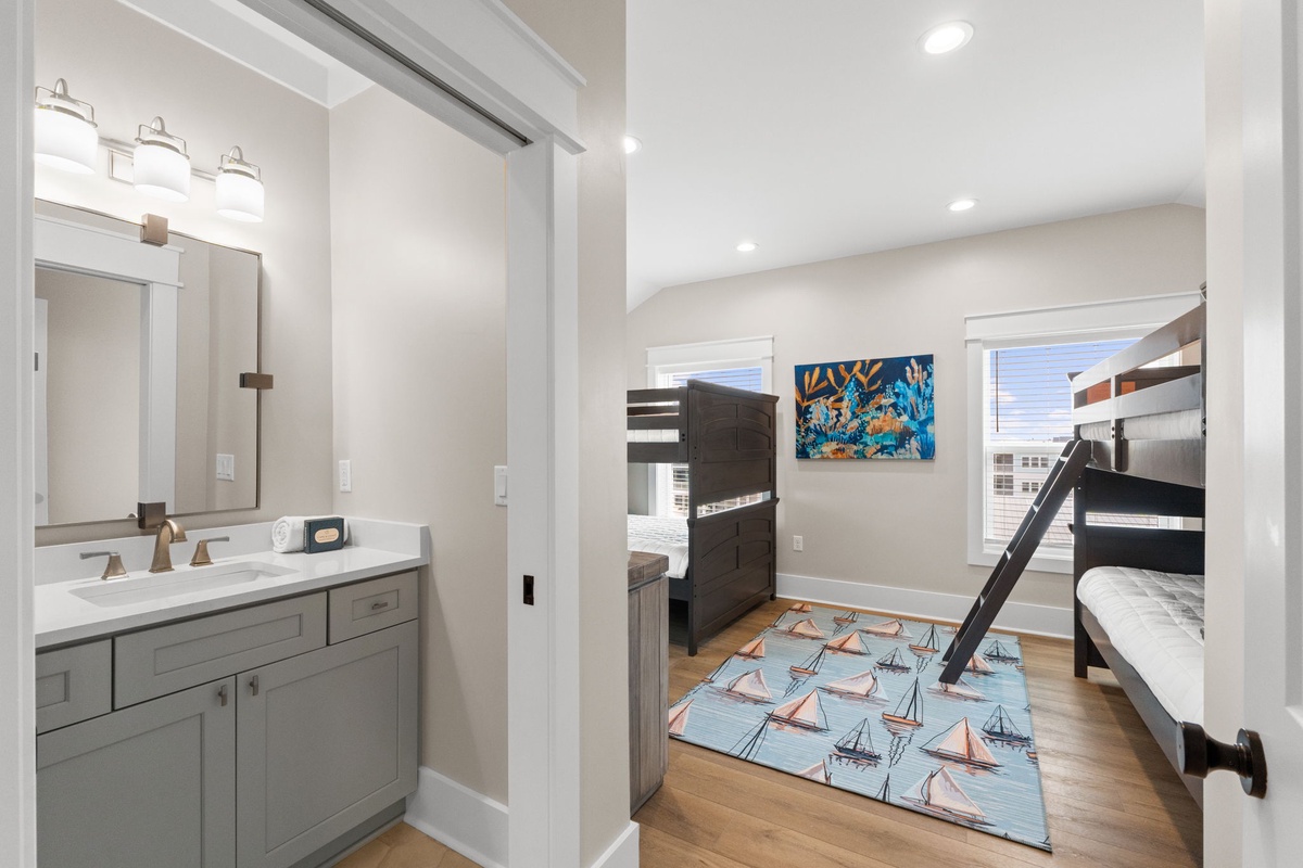 Bright, modern bedroom with two cozy bunk beds—perfect for the kids to share their vacation stories at night. A private en suite bathroom keeps mornings easy and stress-free.