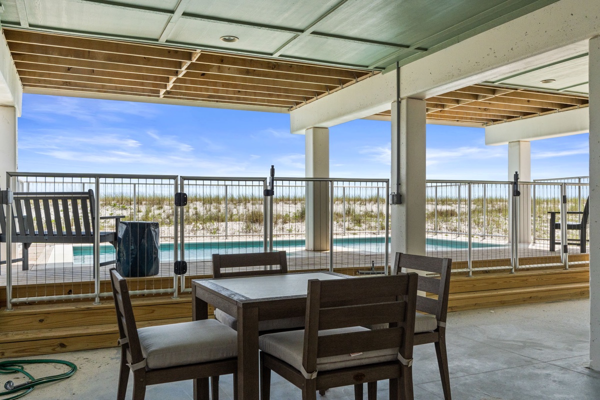 Your private terrace with stunning pool and beach access invites you to unwind under the shade, soaking in coastal breezes and endless blue horizons.