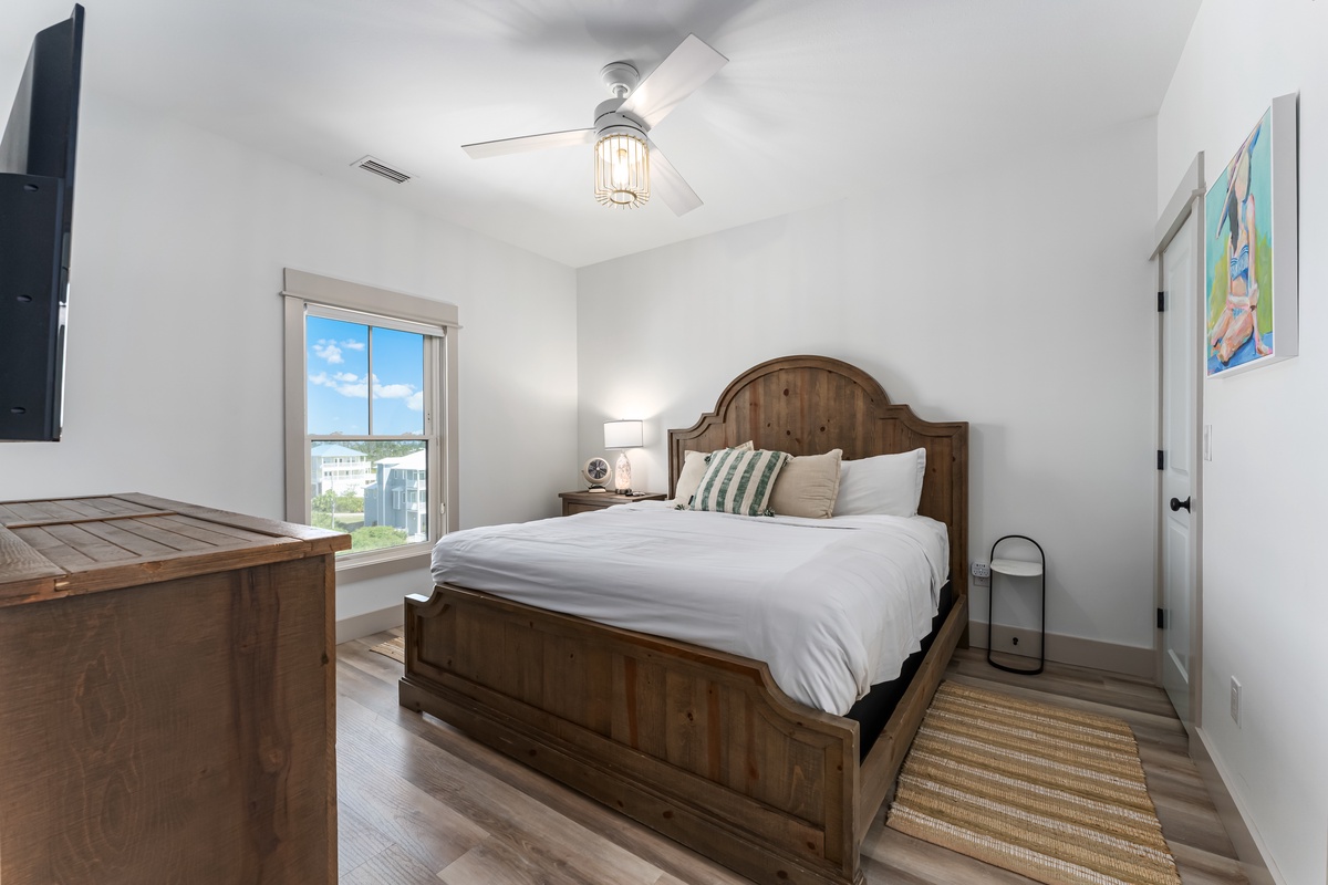 Rest easy in your serene bedroom with rustic charm, city views, and a cozy ceiling fan to keep you comfortable.