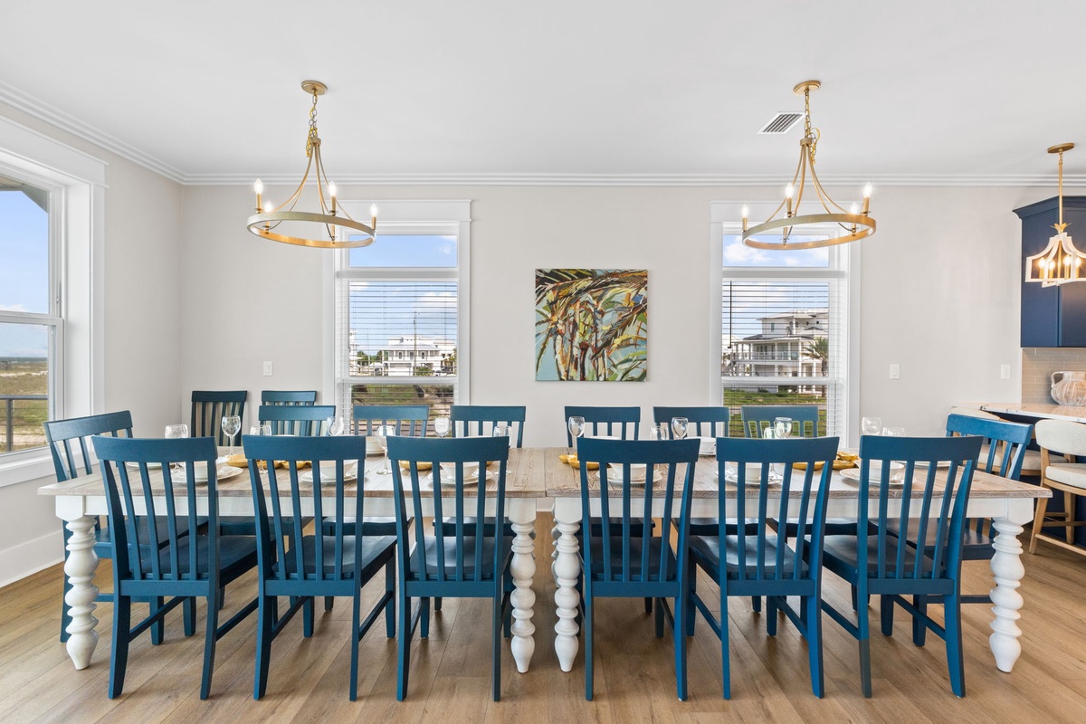Gather your whole group around this stunning farmhouse dining table, where coastal charm meets everyday comfort. Natural light pours in through generous windows, setting the perfect scene for shared meals and lasting memories.