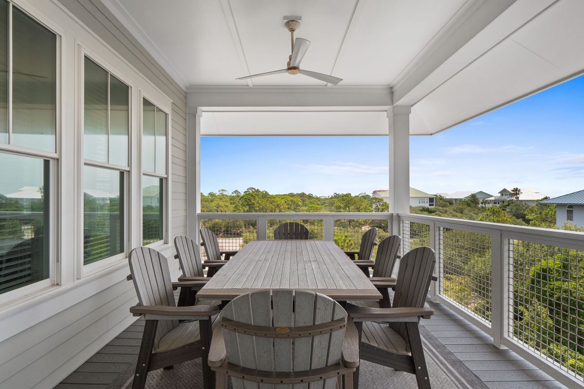 Step out onto your private balcony and gather around the spacious dining table, where you'll enjoy meals surrounded by lush natural views and refreshing coastal breezes.