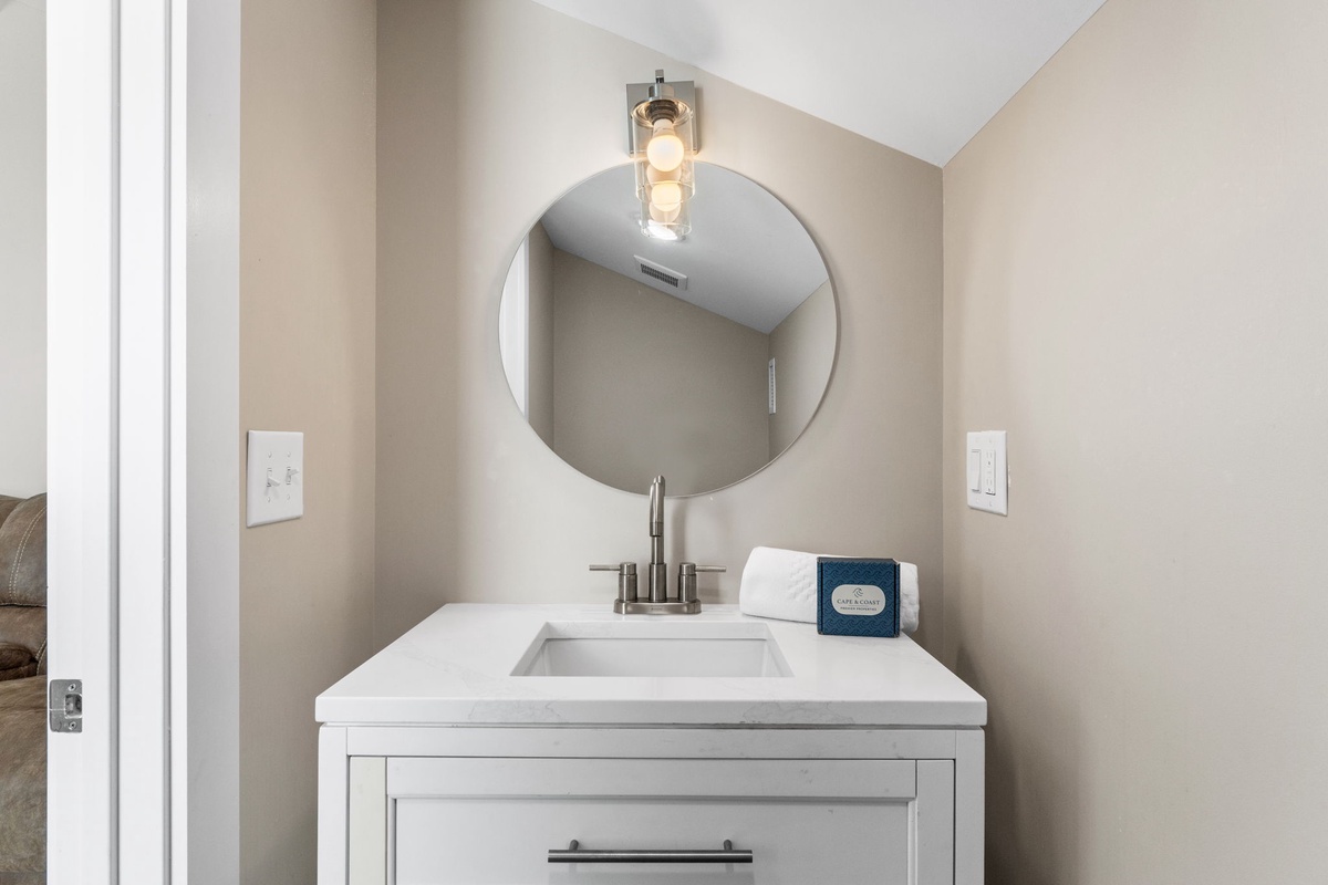 Freshen up in your stylish powder room featuring modern fixtures, elegant lighting, and premium amenities for your comfort.