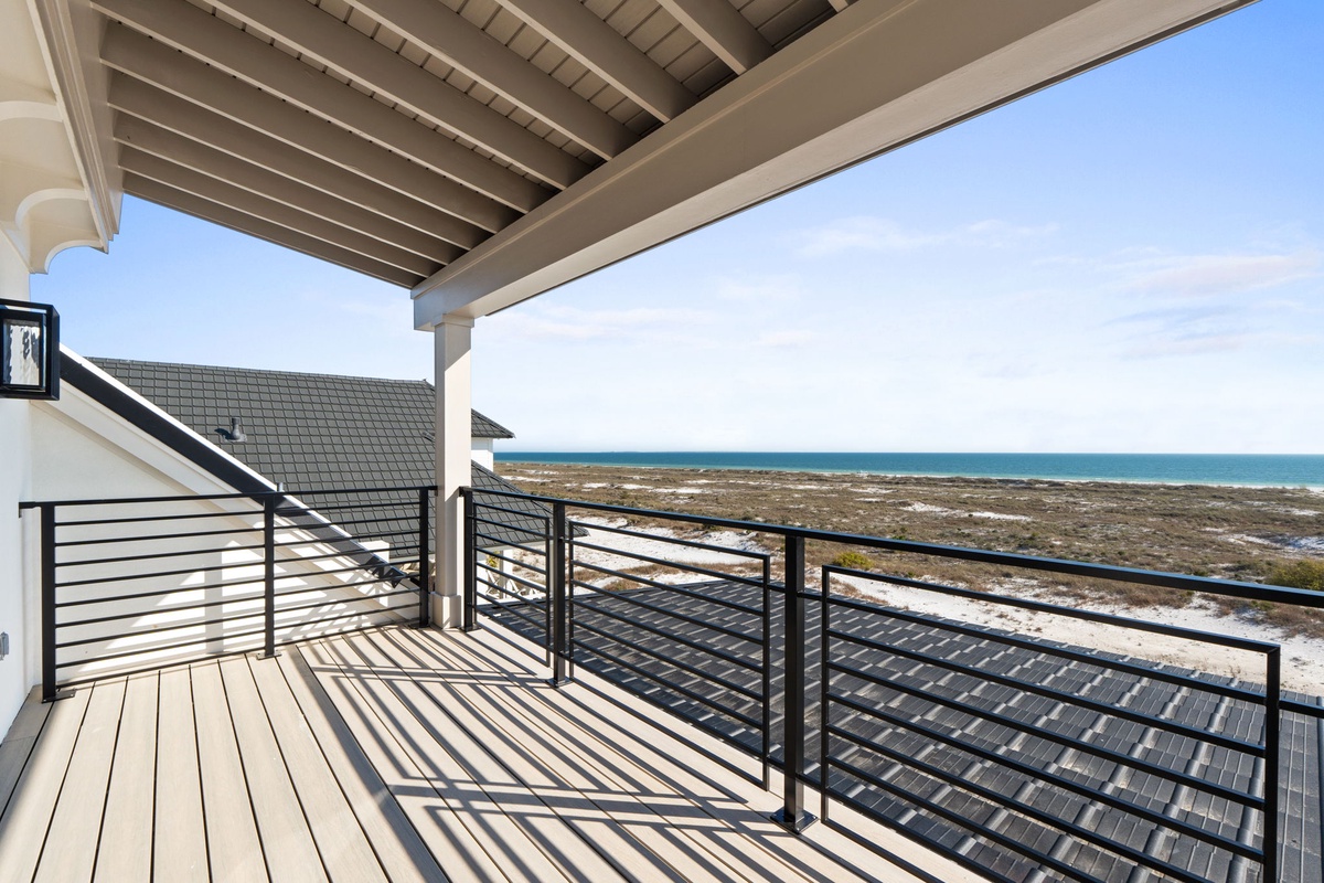 Spectacular oceanfront deck with unobstructed views of pristine coastline and turquoise waters.