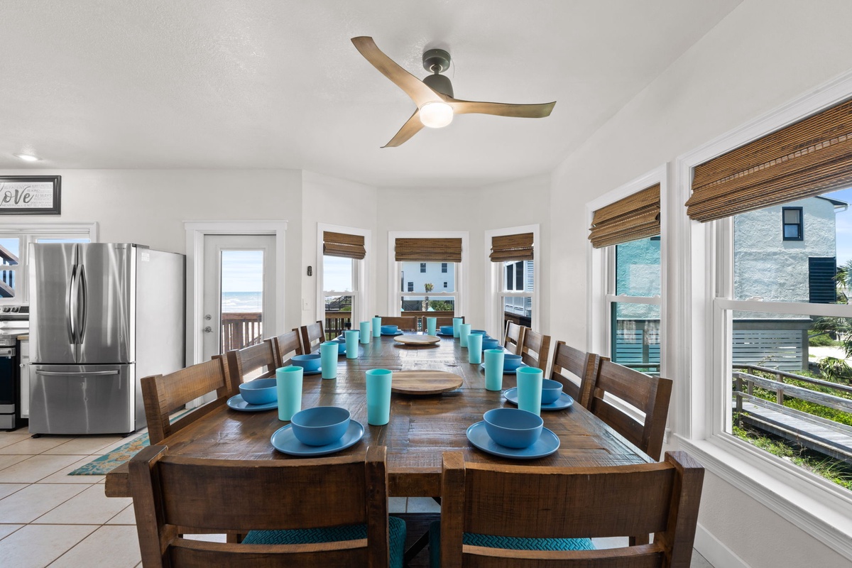 Gather around this beautiful dining table set for twelve, where ocean breezes and coastal views create the perfect backdrop for your memorable meals together.