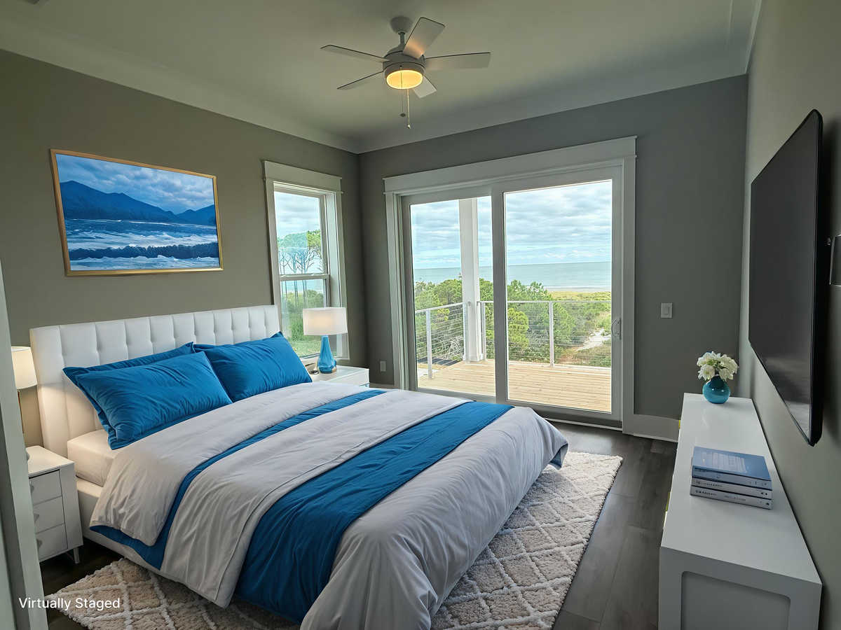 Your peaceful bedroom retreat features ocean-blue accents and opens to your private terrace with stunning coastal views.
