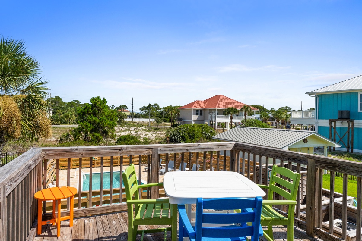 This coastal neighborhood features a mix of beach homes and natural vegetation typical of a relaxed shoreline community.