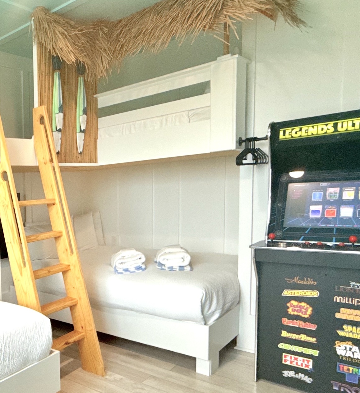 Your adventure-themed bunk room features cozy sleeping spaces and a vintage arcade game for endless family fun together.