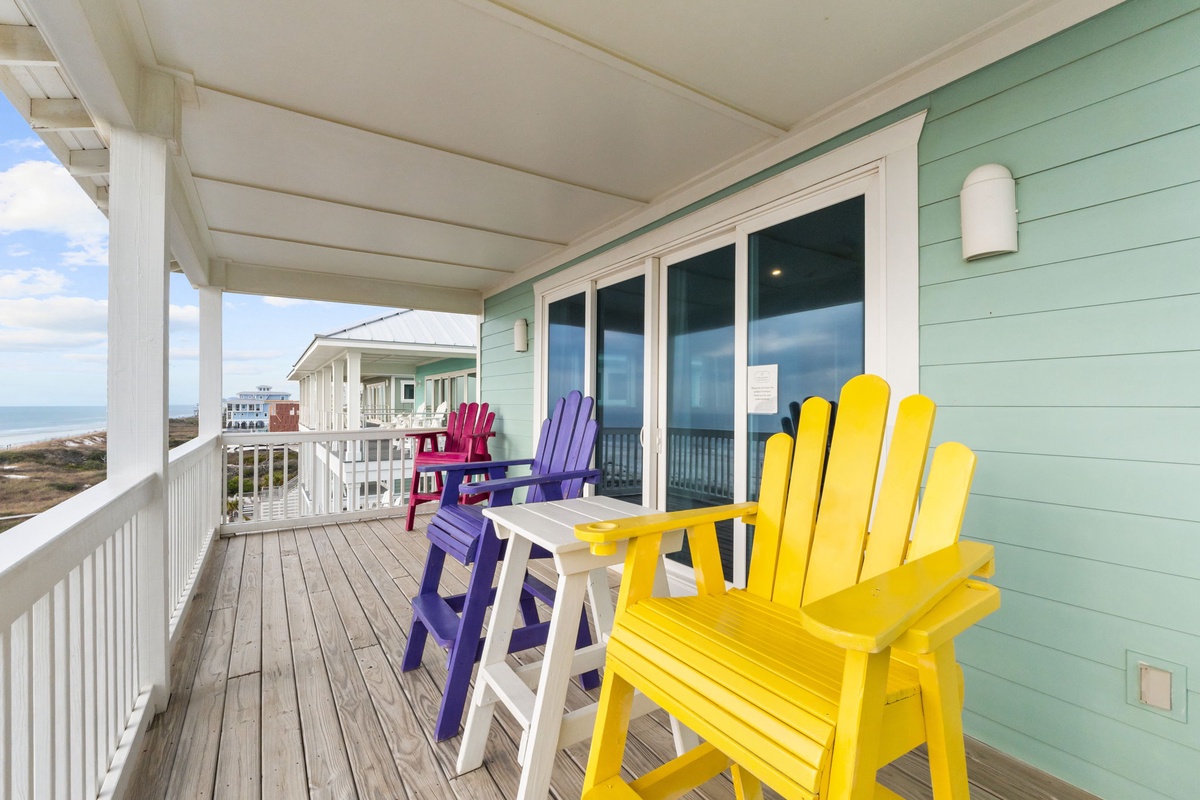 Sink into colorful Adirondack chairs on your covered deck and watch the ocean views unfold before you.