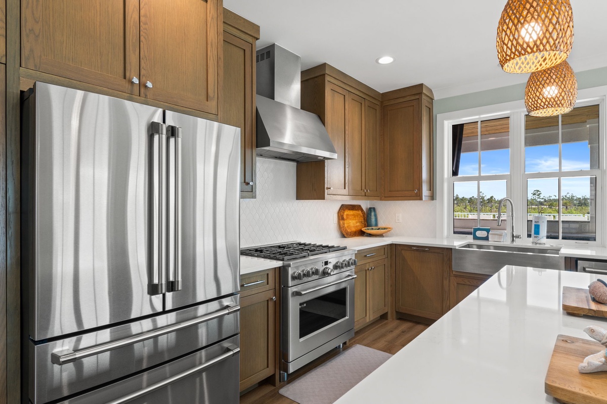 Your fully-equipped kitchen awaits with stainless appliances, gas range, and natural light flooding through the window—perfect for preparing meals with ease and style.