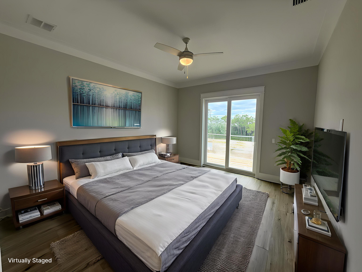 Sink into the plush comfort of your king-sized bed with crisp linens, while the ceiling fan keeps you cool. Natural light floods through sliding doors to your private balcony.