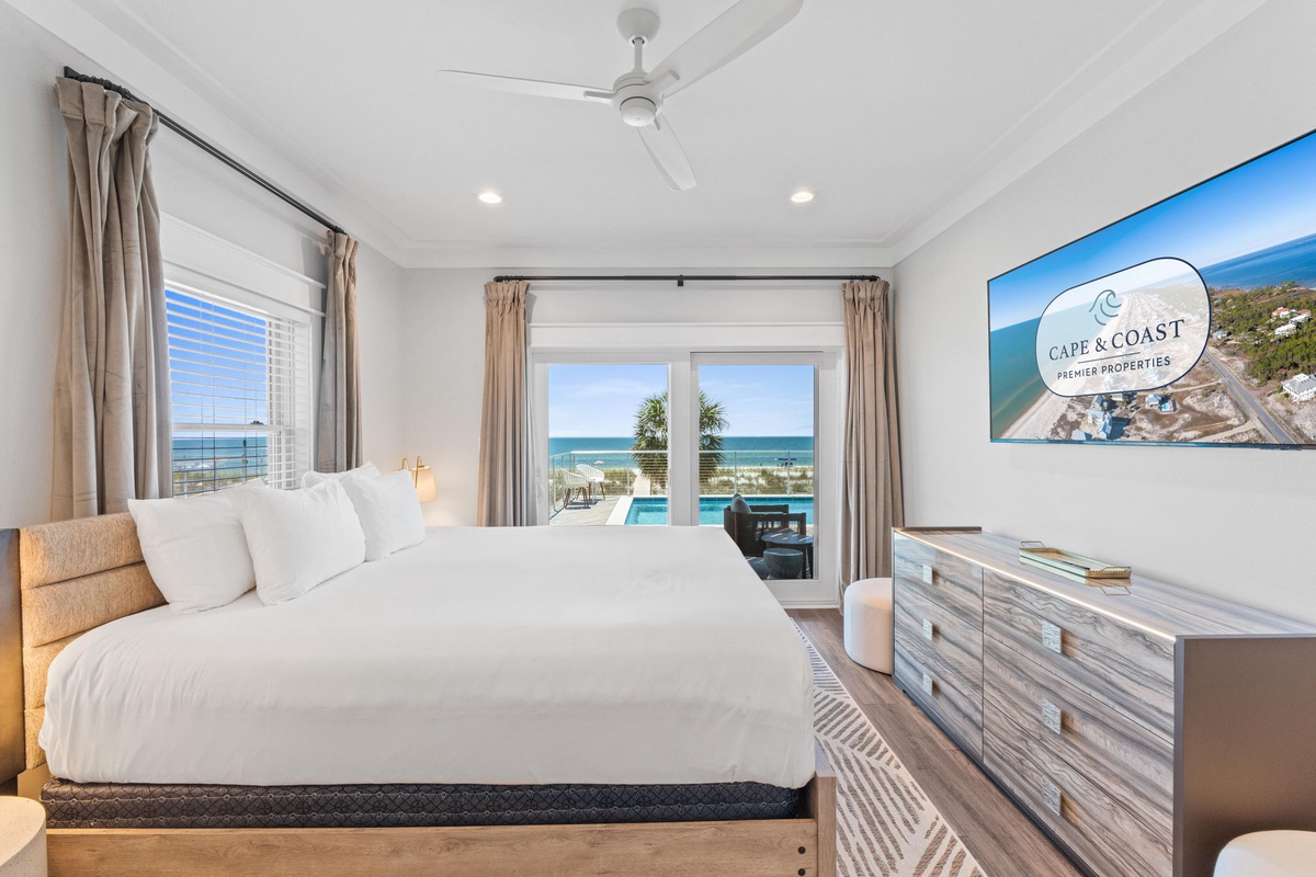 Wake up to breathtaking ocean views from your plush bed. Step out to the pool or relax with stunning coastal vistas through expansive windows in your serene, light-filled bedroom.