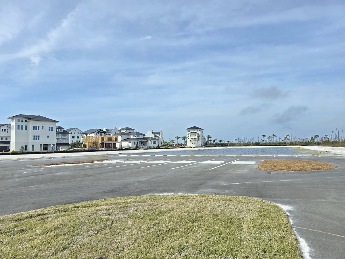Coastal neighborhood featuring diverse beach houses and vacation rentals near the waterfront area.