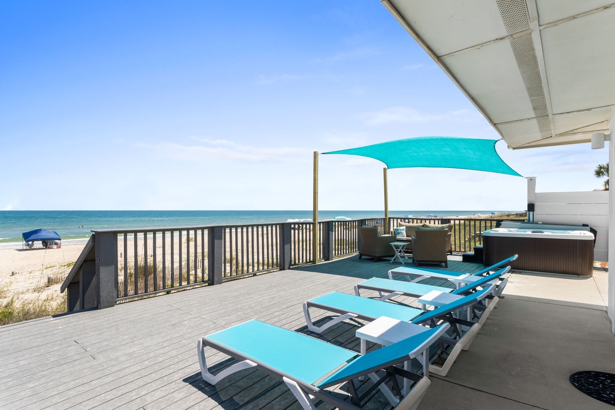 Your beachfront terrace features turquoise loungers and a hot tub, perfectly positioned for soaking up stunning Gulf views and endless sunshine.