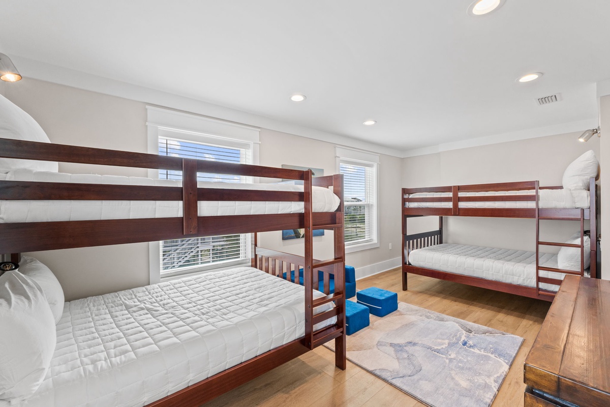 Your group will love this bright and spacious bunk room, perfect for the kids to share stories before sleep. Soft linens and plenty of natural light create a cozy, welcoming retreat for young travelers.
