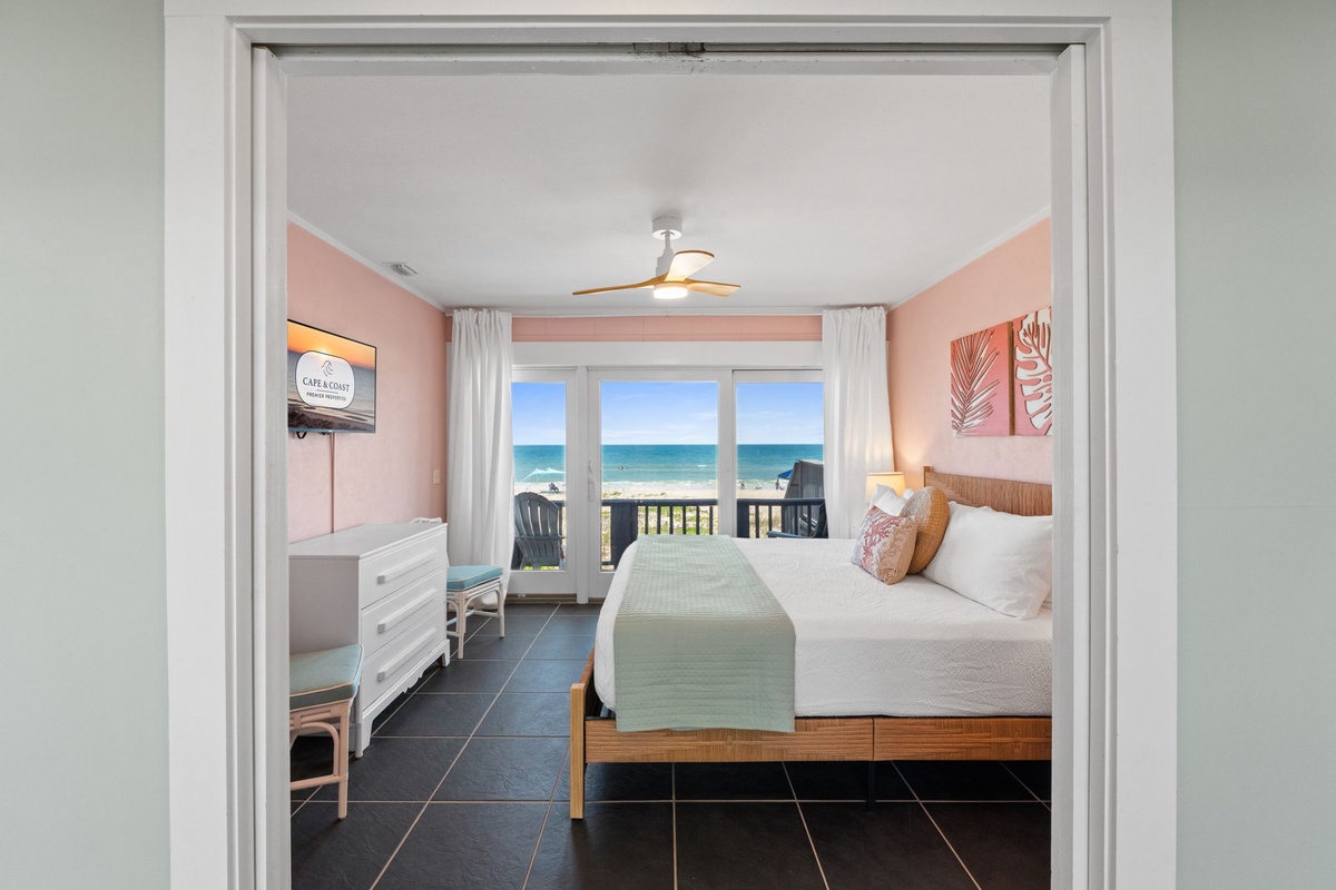 Wake up to sparkling ocean views framed by soft coral walls and coastal decor. Your private balcony opens to sea breezes and endless blue horizons—perfect for morning coffee or sunset moments.