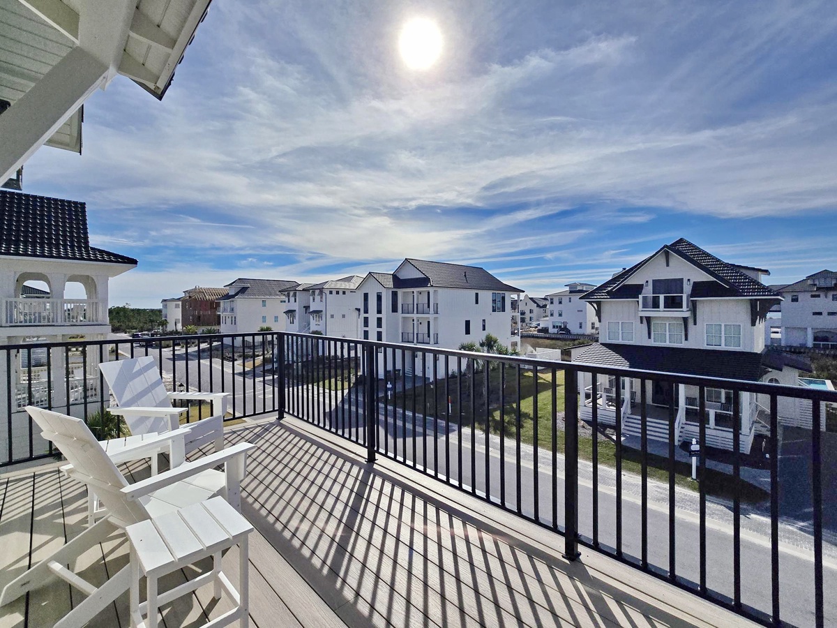Step onto your private balcony and soak up coastal sunshine while enjoying peaceful neighborhood views from your elevated retreat.