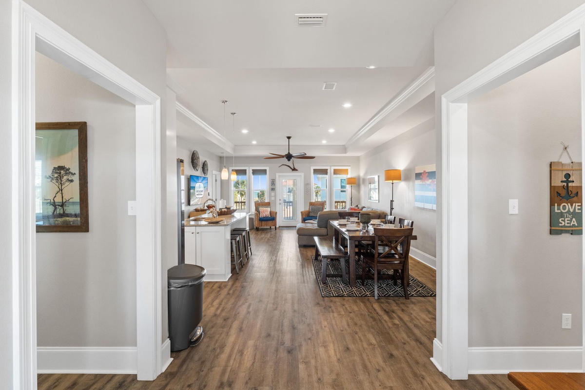 Step into this bright, open-plan living space where coastal charm meets modern comfort, perfect for gathering with loved ones.
