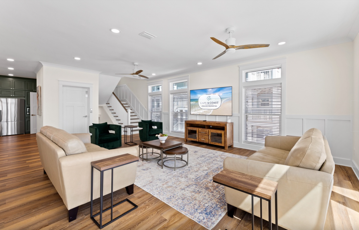 Sink into plush seating while your favorite shows play on the large TV, with coastal breezes from ceiling fans keeping you comfortable.