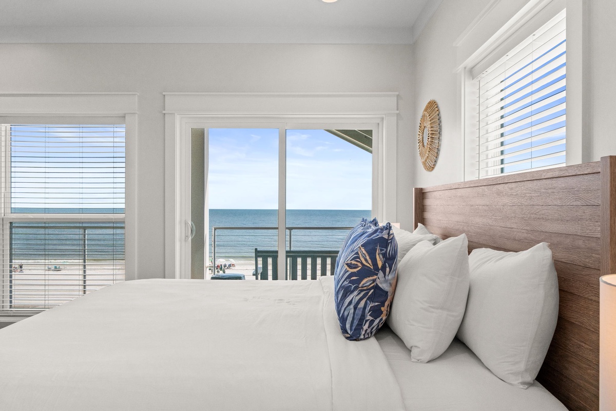 Wake up to stunning ocean views framing your bed. Open your eyes to the gentle sound of waves and breathtaking beachfront scenery just beyond your windows.