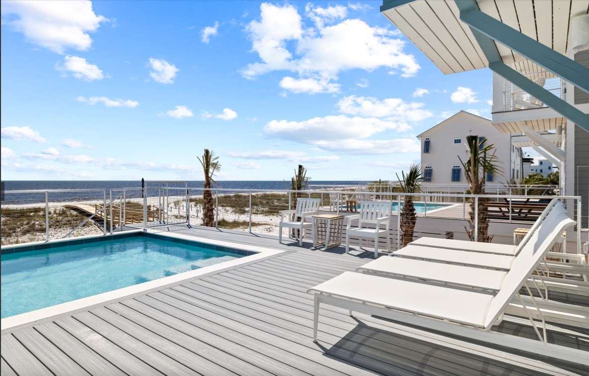 Dive into your private pool while soaking up stunning ocean views from this sun-drenched deck—pure coastal bliss awaits.