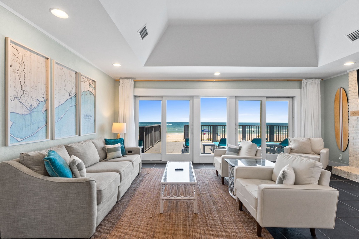Sink into plush sofas and watch the waves roll in through floor-to-ceiling windows. Your beachfront escape features coastal-inspired décor and opens directly to the sand.