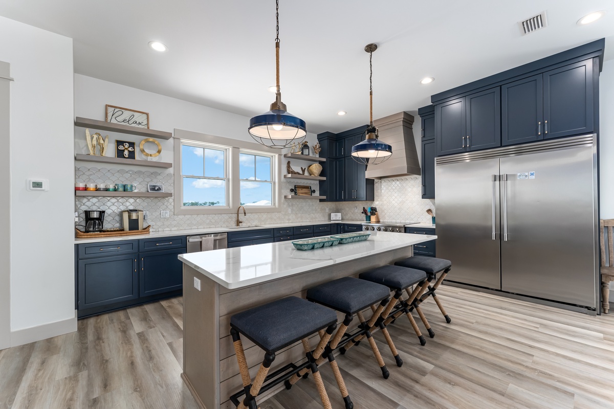 Your gourmet kitchen awaits with gleaming countertops, premium appliances, and a spacious island perfect for morning coffee or evening meals together.