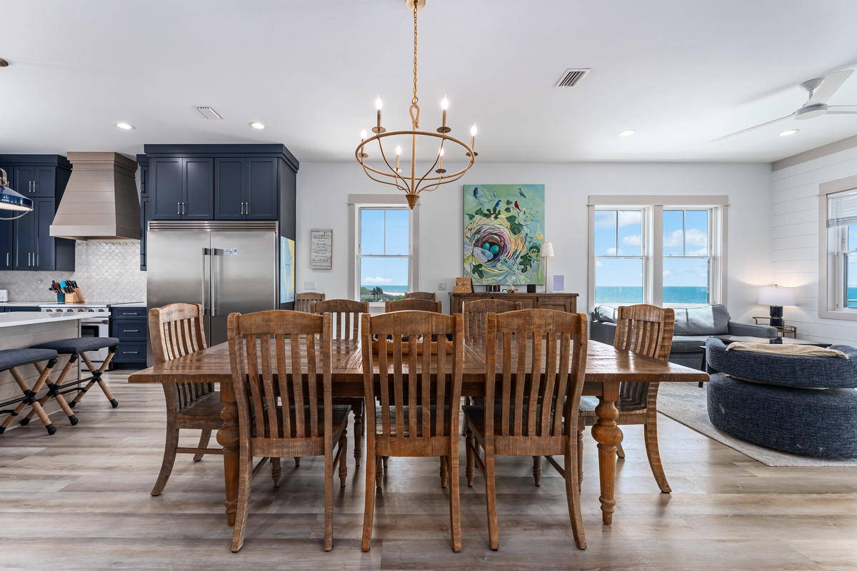 Gather around your stunning dining table where ocean views create the perfect backdrop for memorable meals together.
