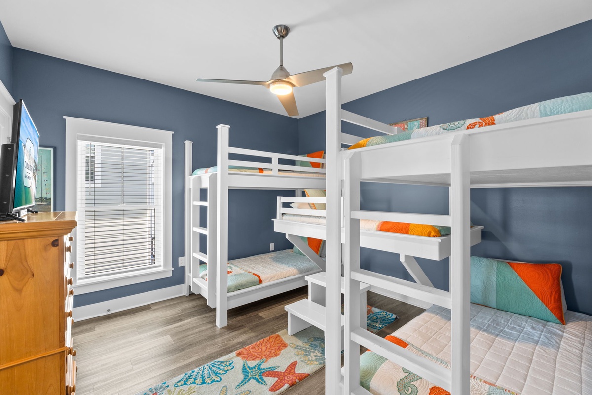 Your kids will love this fun bunk room with bright ocean-themed bedding and plenty of space for family adventures.