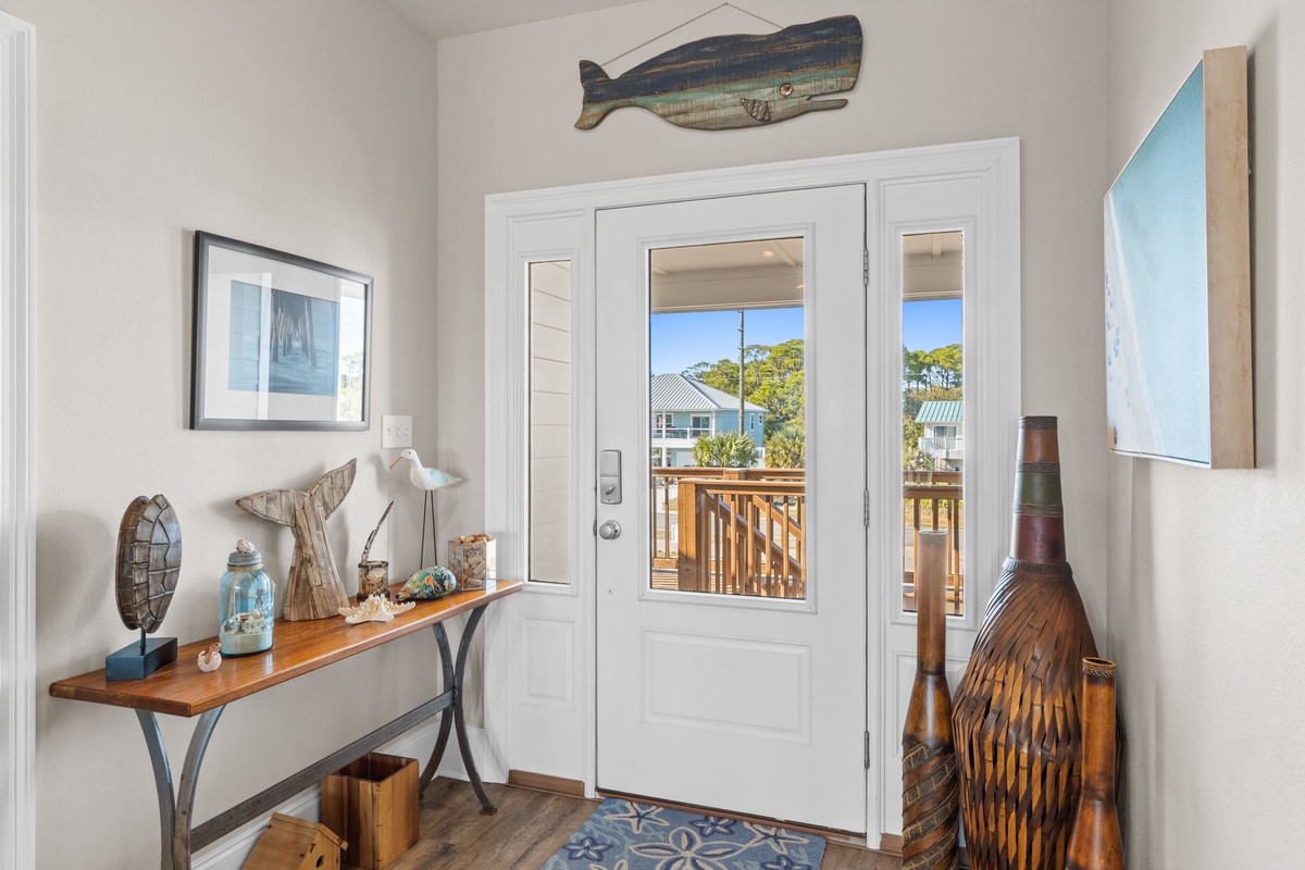 Step into your coastal haven with nautical touches and warm wood accents welcoming you home.