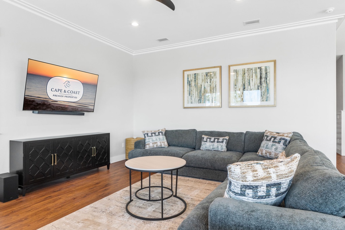 Sink into this plush sectional where you'll enjoy movie nights with the wall-mounted TV and elegant decor creating your perfect relaxation retreat.