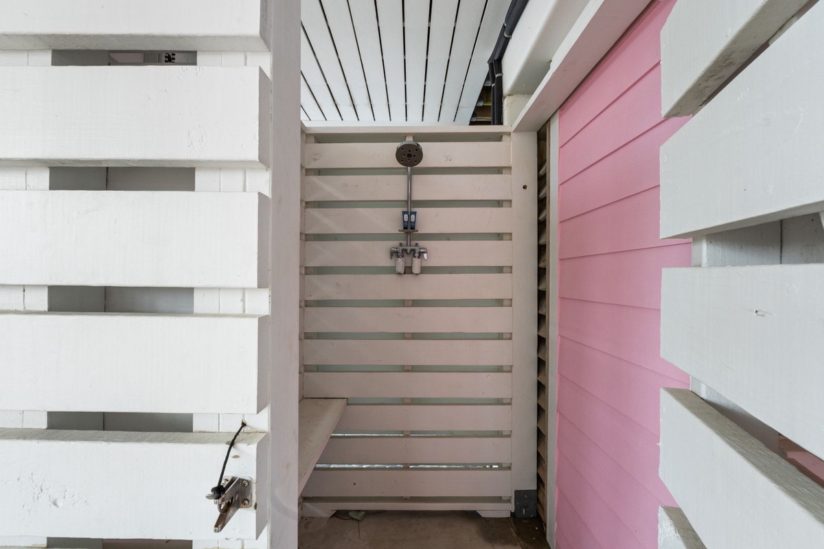 Aerial perspective showcasing the property's modern architectural layout, featuring open-plan spaces with distinctive pink and neutral tones.
