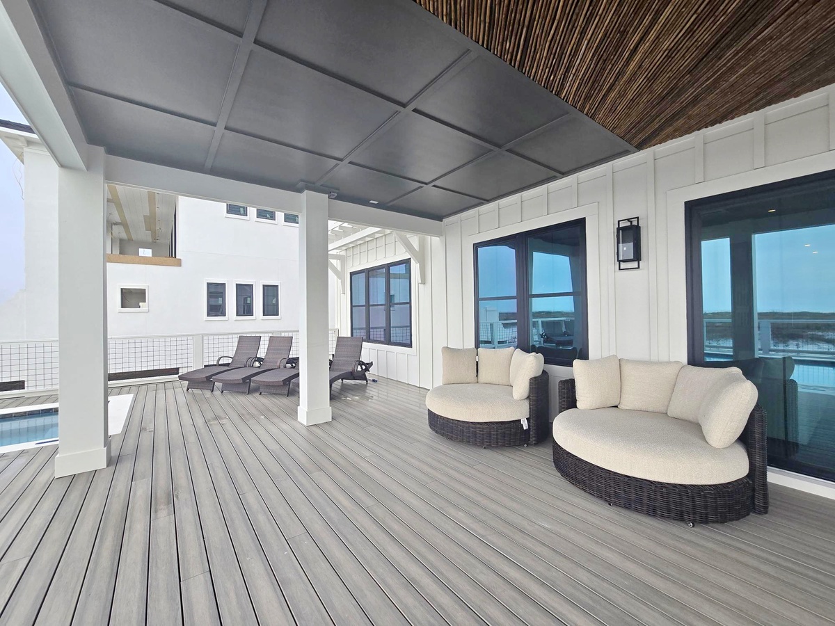 Unwind on your private covered deck with plush seating and pool loungers - your perfect retreat for relaxation.