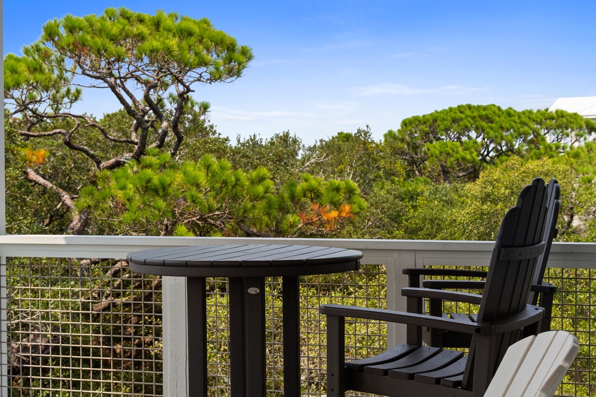 Settle into your private balcony with lush pine trees and natural greenery as your backdrop, perfect for morning coffee or evening relaxation.