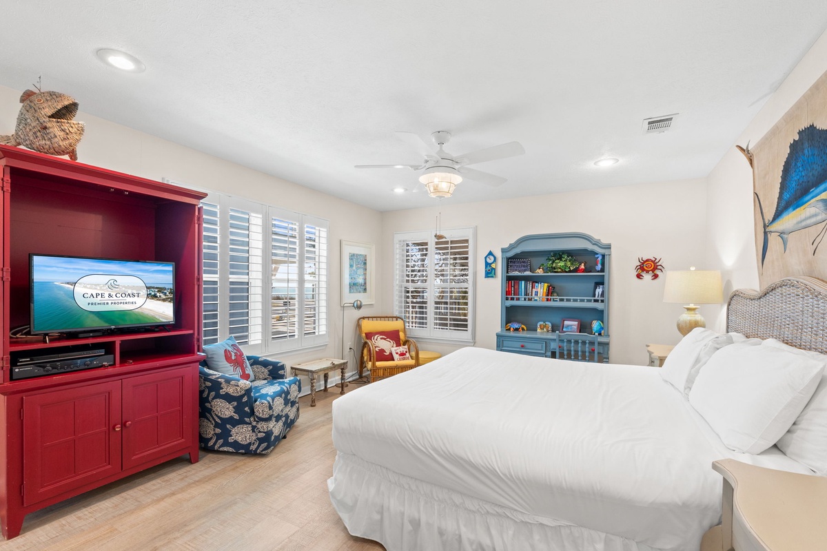 Drift off in this charming bedroom where coastal colors meet comfort—your private retreat features entertainment and relaxing nautical touches.