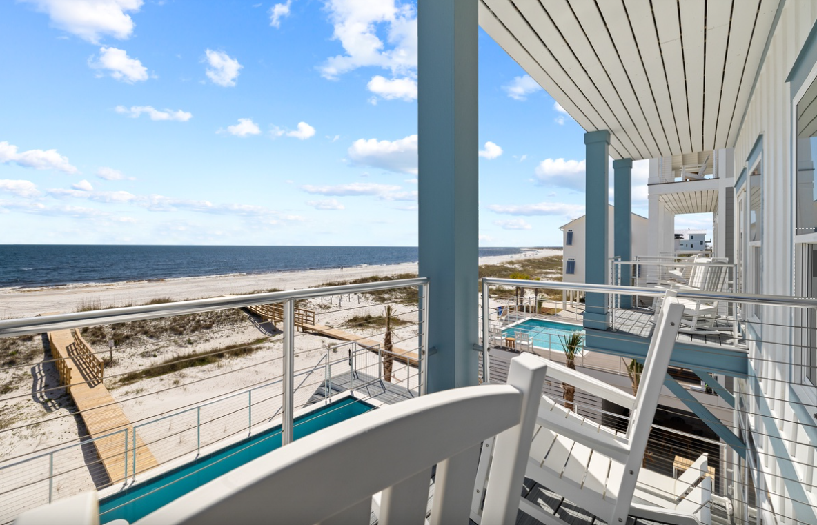 Sip your morning coffee on this stunning balcony with sweeping ocean views, pristine beach access, and refreshing pool below.