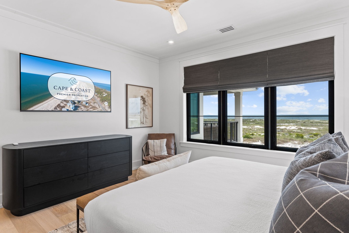 Wake up to sweeping coastal views from your bed. Natural light pours in through expansive windows while the ceiling fan keeps you comfortable all day long.